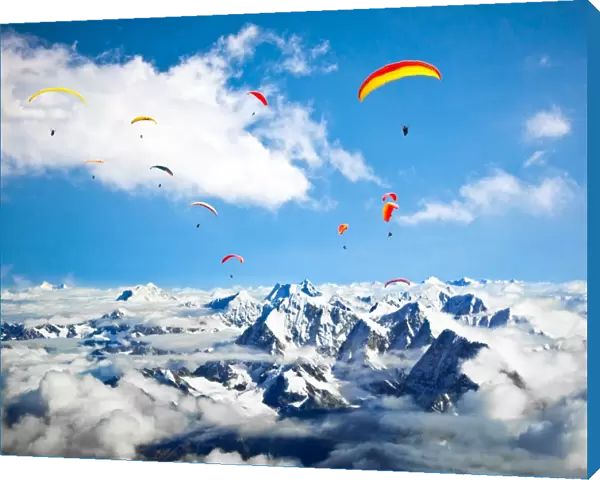 Paraglider flying against the Himalayas-Everest region, Nepal