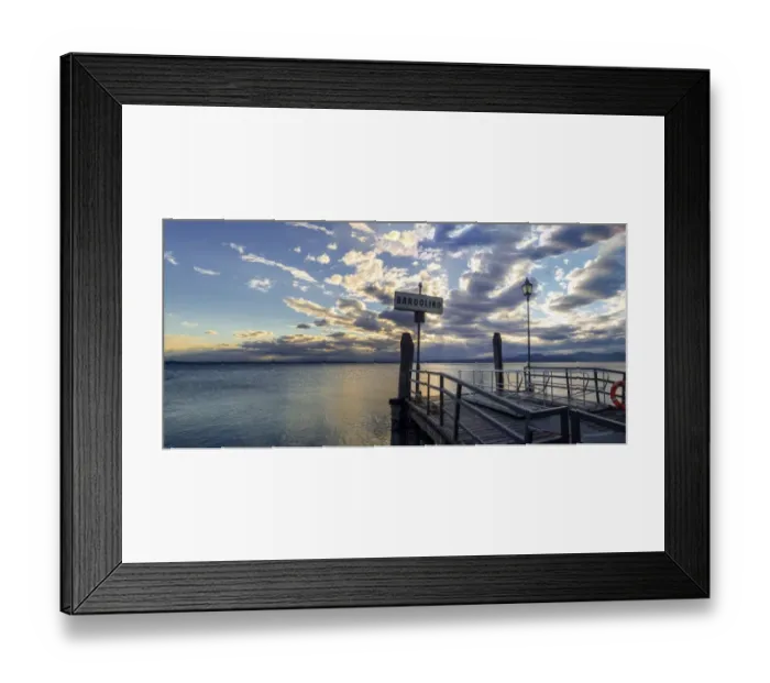 Framed Print : Sunset over pier at lake Garda in Bardolino Italy. Panoramic view on sunset over pier Framed Print : Sunset over pier at lake Garda in Bardolino Italy. Panoramic view on sunset over pier