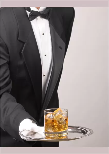 Butler holding Cocktail on tray
