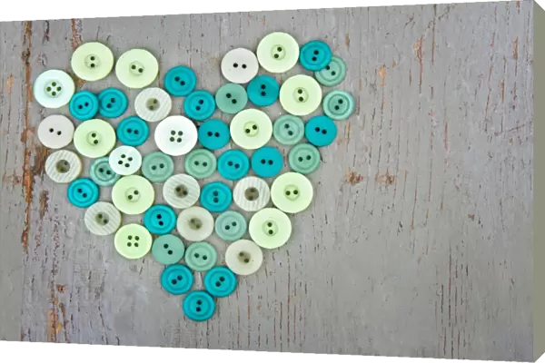 Green buttons on wooden background