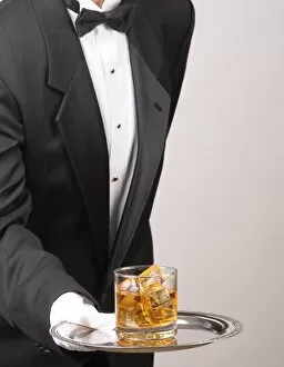 Fotolia Gallery: Butler holding Cocktail on tray