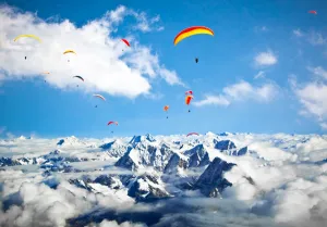 Paraglider flying against the Himalayas-Everest region, Nepal