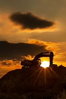 Sand Collection: skyline excavator with colored sunset