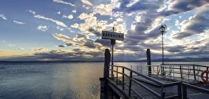 Beach Collection: Sunset over pier at lake Garda in Bardolino Italy. Panoramic view on sunset over pier